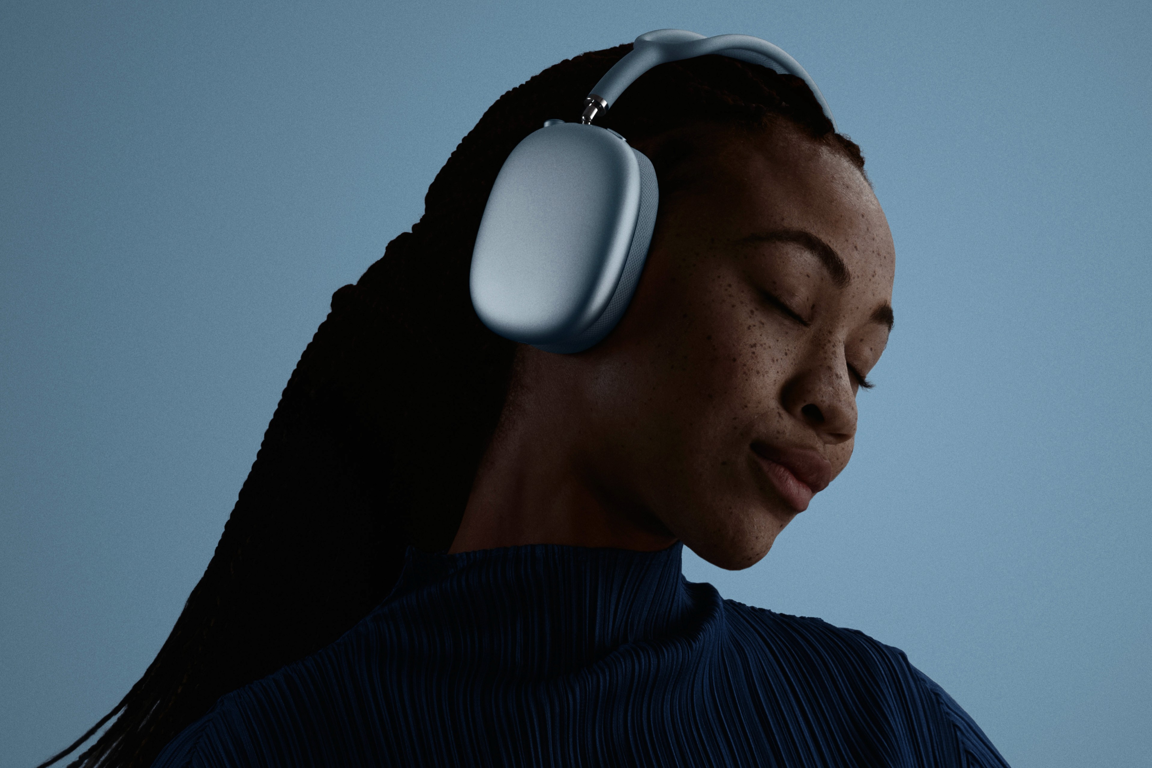 lady wearing blue airpods max